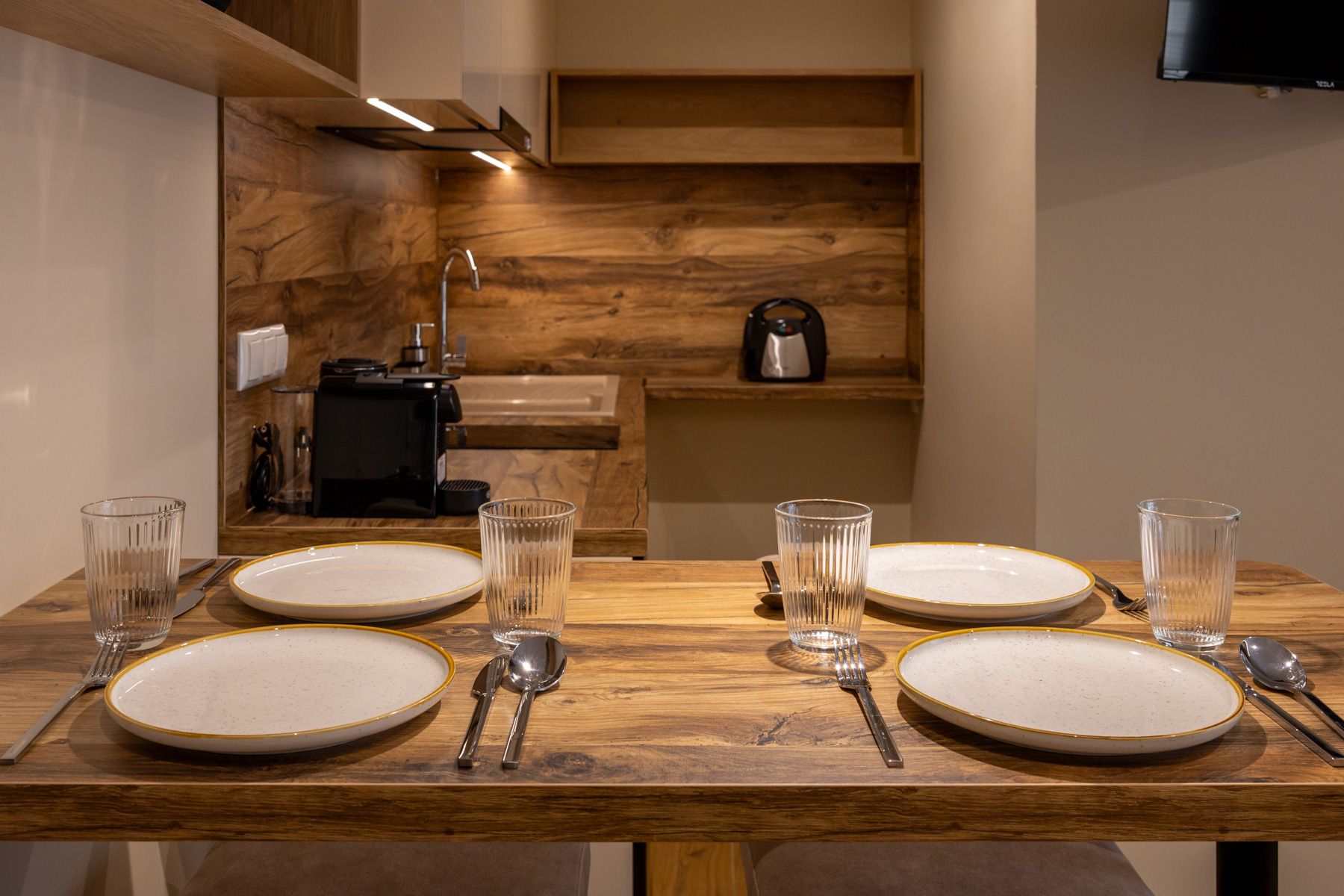Anemoessa's oak table laid for four