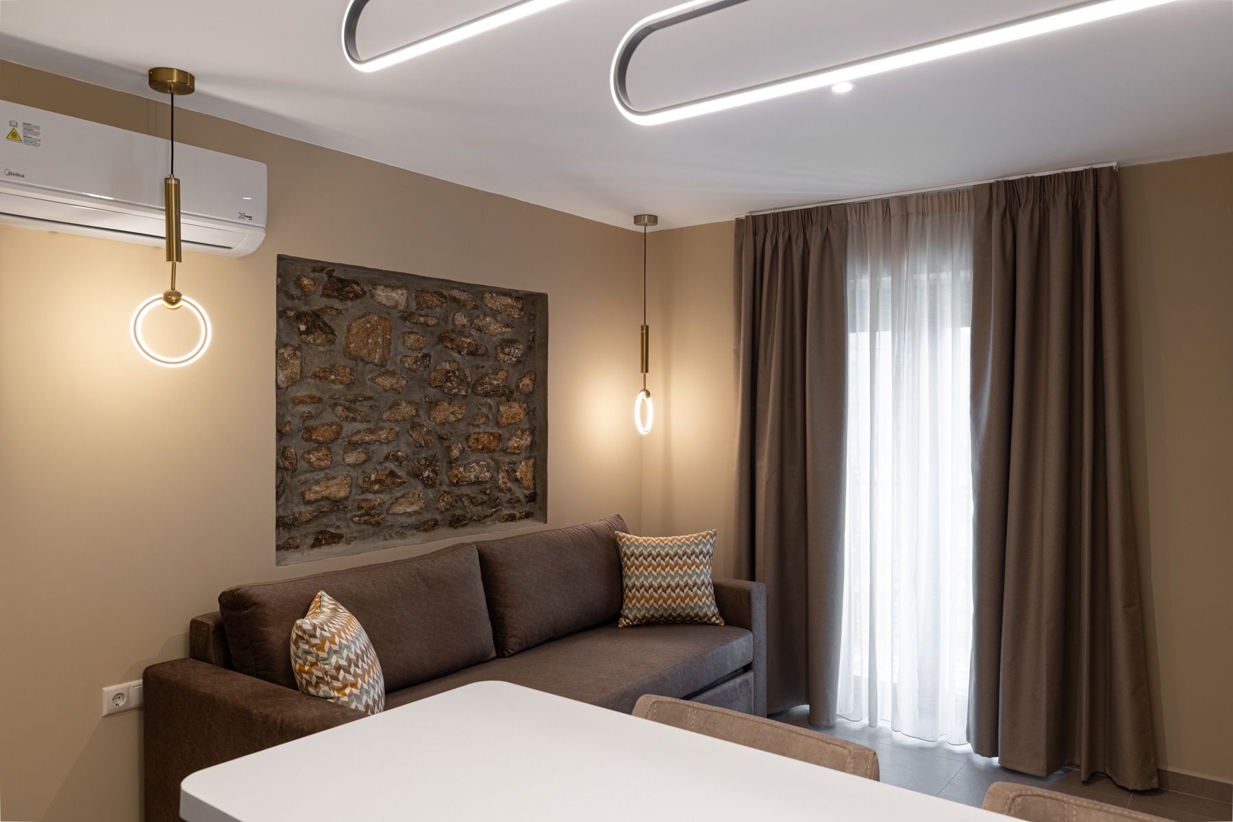 Asteroessa's sitting area, with the curtains drawn back beside the stone panel